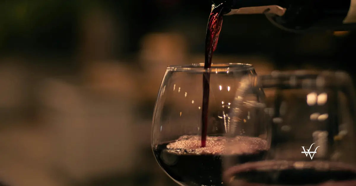 close-up-of-red-wine-poured-into-a-wineglass