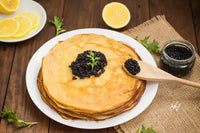 Black caviar on Russian pancakes - blini