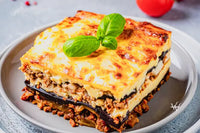 Greek beef moussaka with cucumber and tomato salad